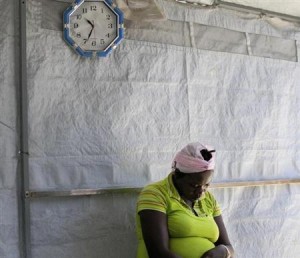 A woman suspected of having cholera waits to be evaluated at a cholera treatment centre run by Medecins Sans Frontieres (Doctors Without Borders) in Port-au-Prince October 21, 2011. REUTERS/Swoan Parker